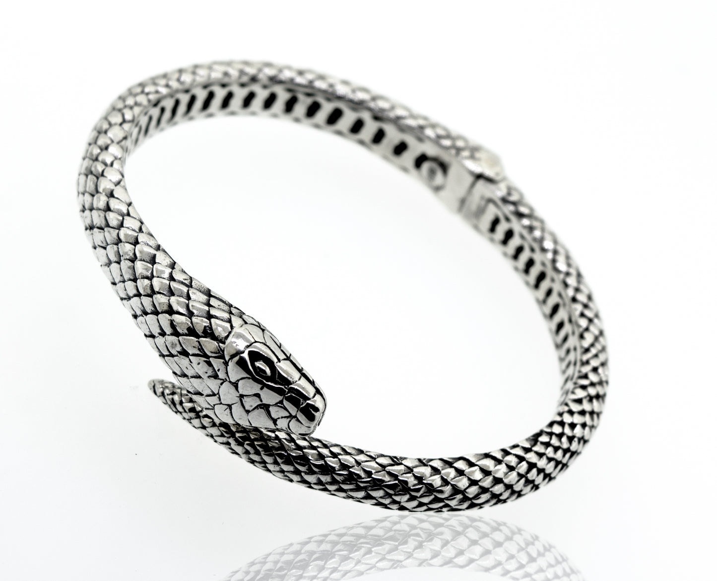 An Enchanting Hinge Snake Bracelet by Super Silver on a white surface.