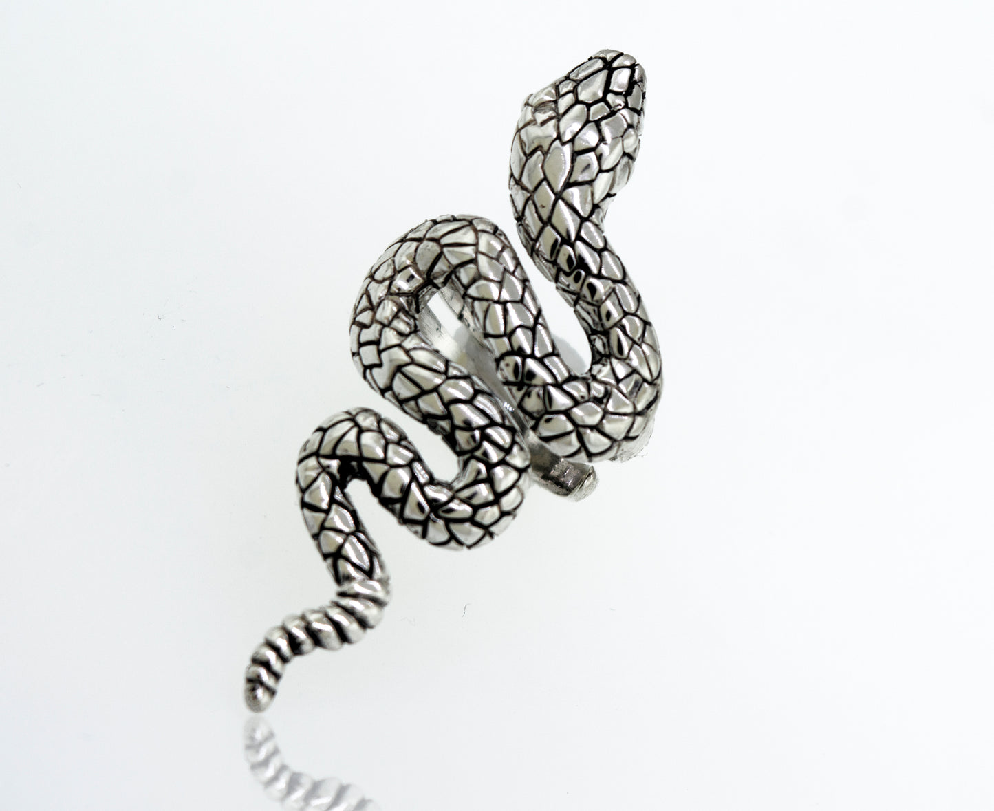 
                  
                    An adjustable Long Alluring Snake Ring crafted by an artisan, resting on a clean white surface.
                  
                