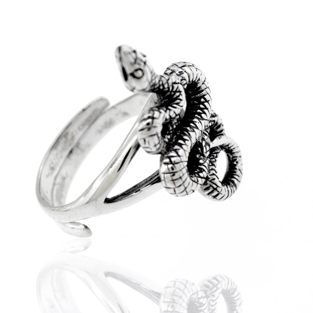An adjustable compelling snake ring on a white background.