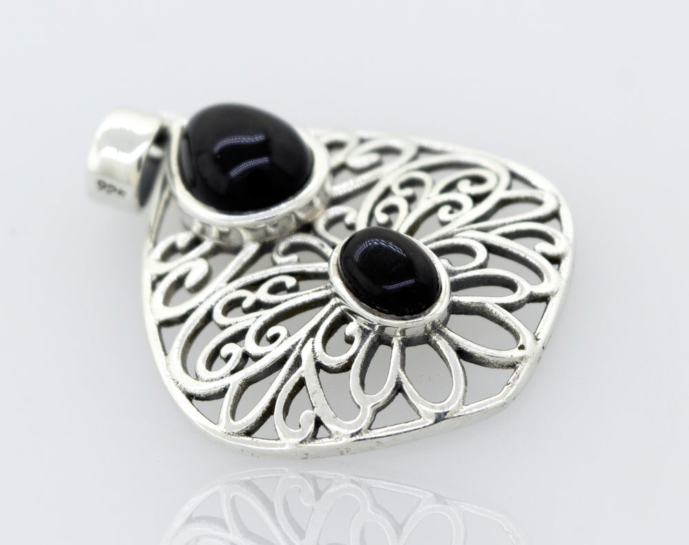 A Super Silver onyx pendant featuring an onyx stone in a freestyle setting.