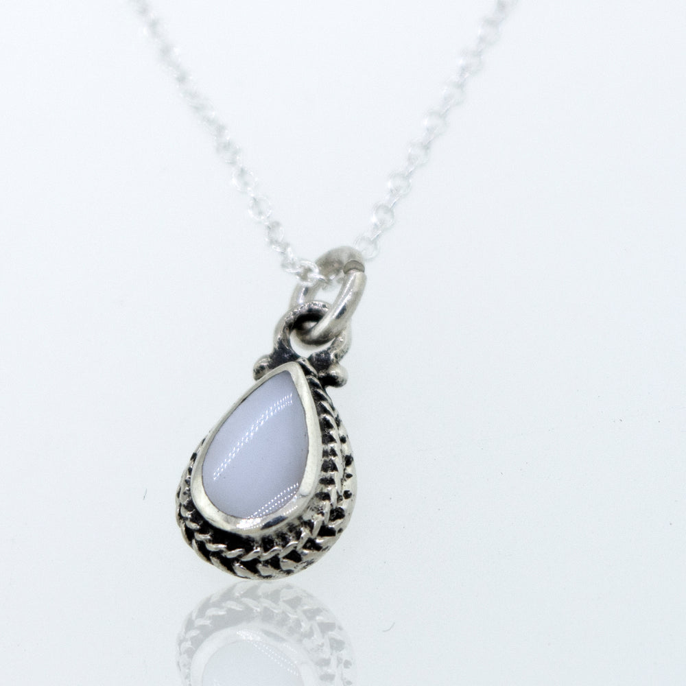 A Mother of Pearl Teardrop Necklace featuring a mother of pearl stone, elegantly crafted in sterling silver with a cable link chain by Super Silver.