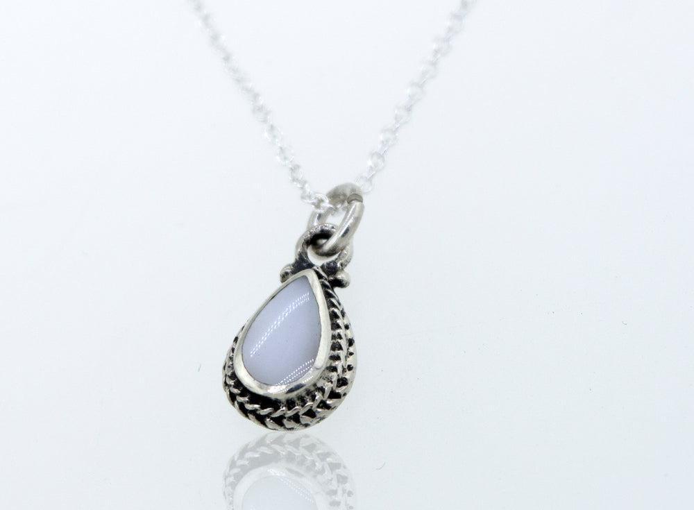
                  
                    A Mother of Pearl Teardrop Necklace featuring a mother of pearl stone, elegantly crafted in sterling silver with a cable link chain by Super Silver.
                  
                