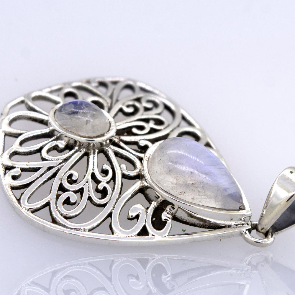 
                  
                    A Super Silver moonstone pendant with a filigree design.
                  
                