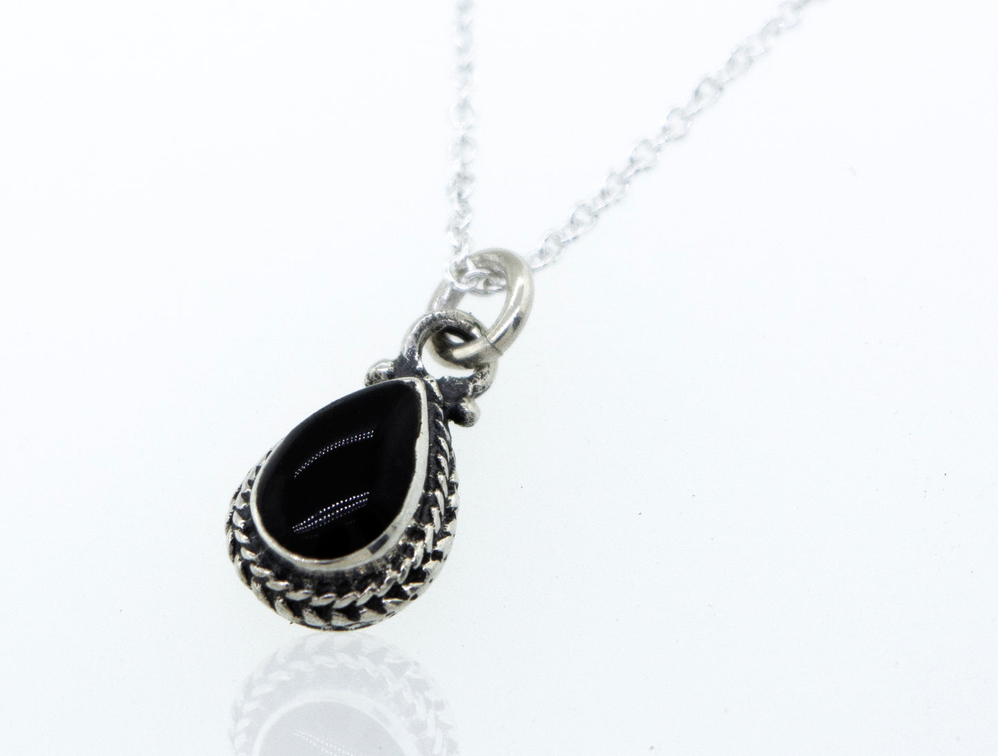 
                  
                    A Onyx Teardrop Necklace inlaid with black onyx on a 925 Sterling Silver chain by Super Silver.
                  
                