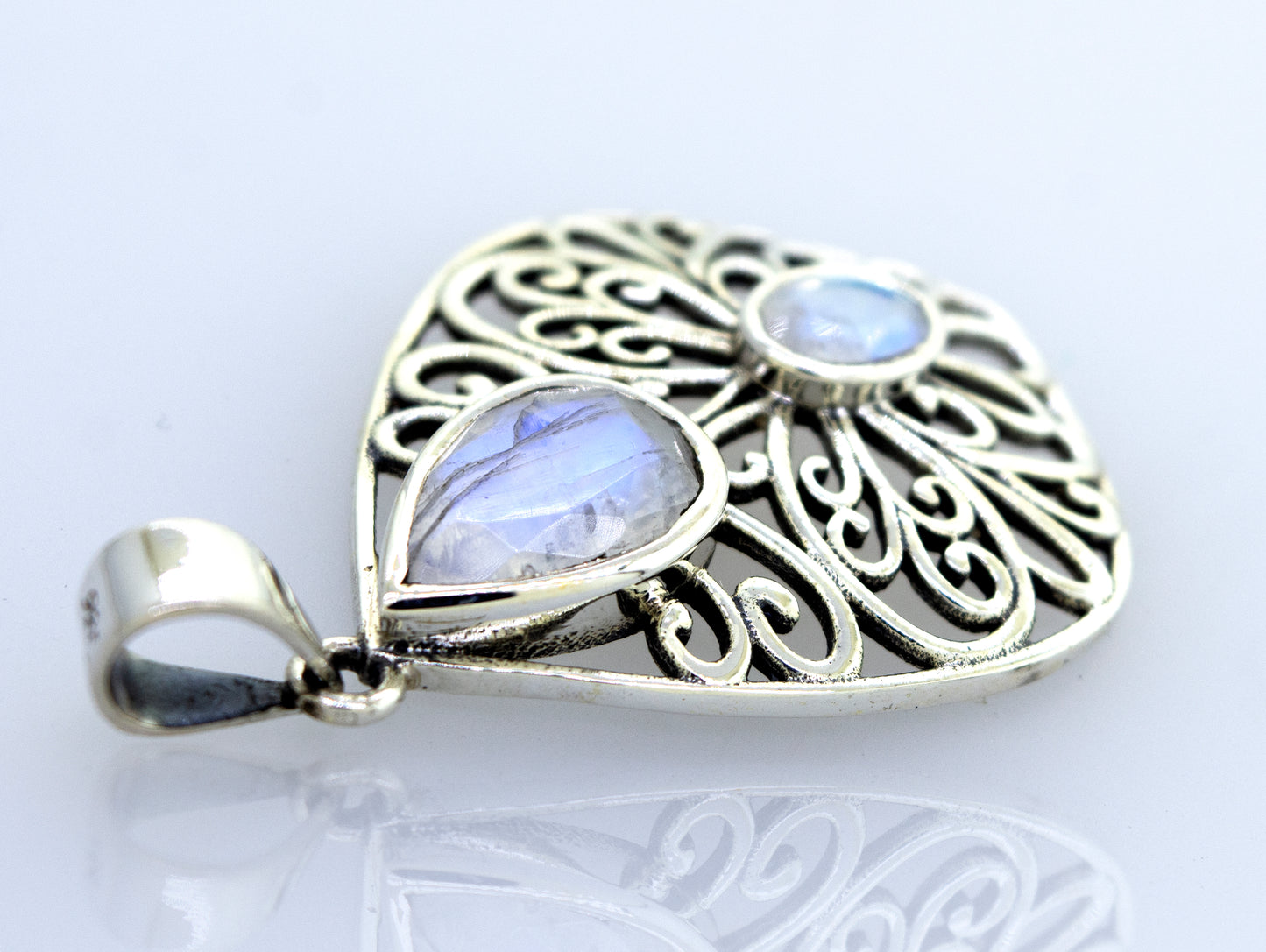 A Super Silver moonstone pendant featuring a delicate filigree design.