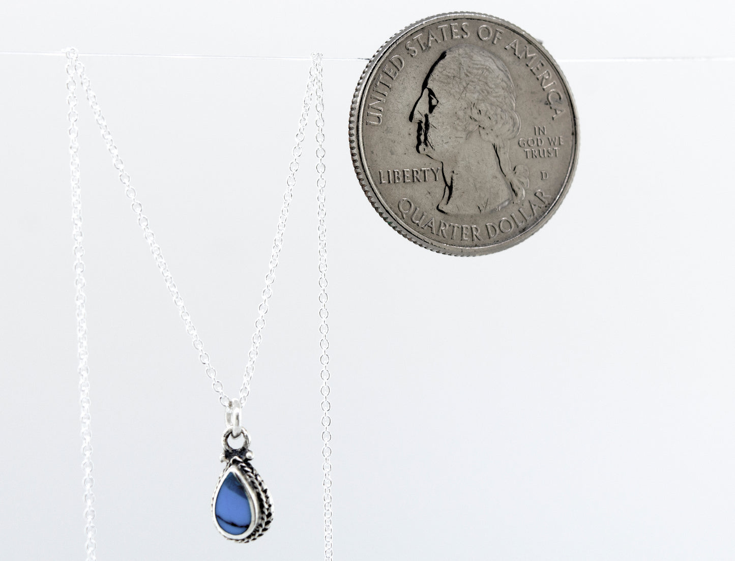A small Blue Turquoise Teardrop Necklace on an 18" Super Silver chain, made of blue turquoise.