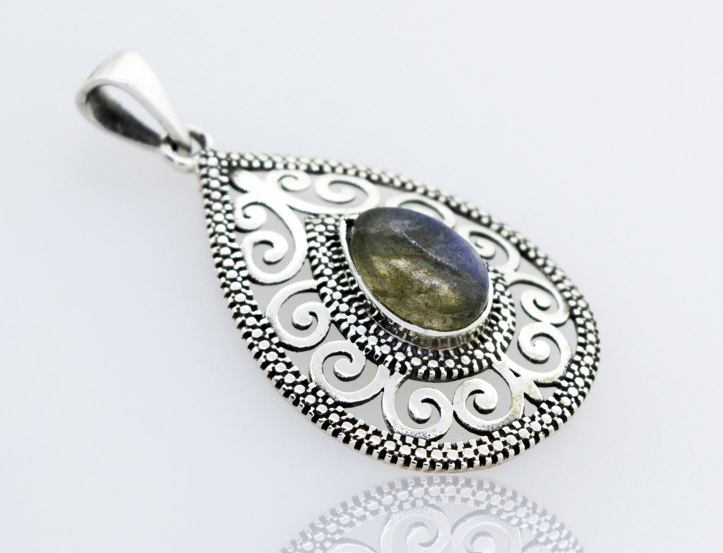 A stunning Super Silver sterling silver filigree pendant featuring a mesmerizing Labradorite Teardrop stone.