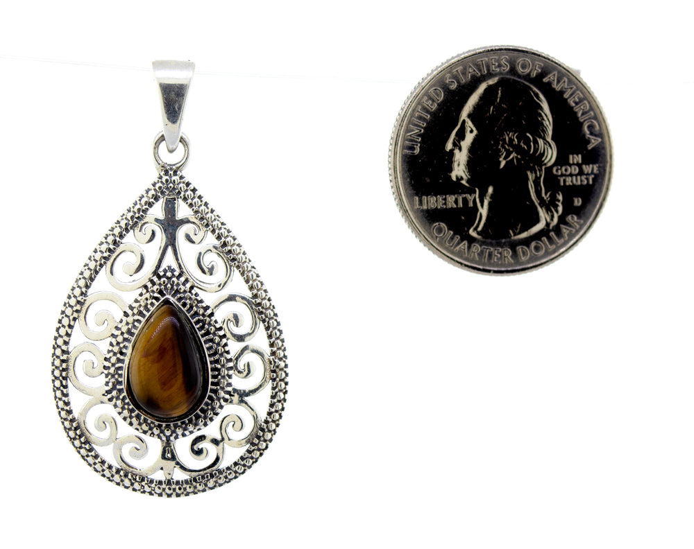 
                  
                    A Moonstone Teardrop Pendant with a teardrop-shaped tiger eye stone from Super Silver.
                  
                