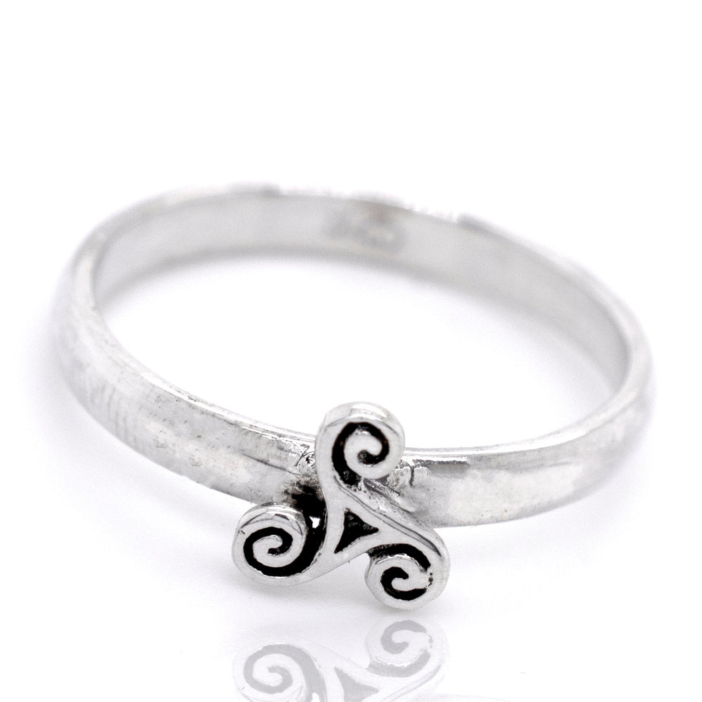 An intricately designed Dainty Triskelion Ring made of sterling silver.