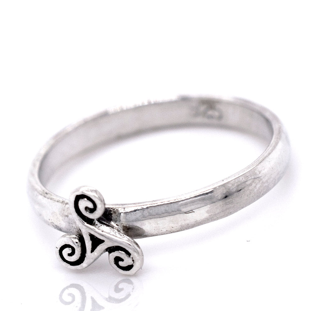 
                  
                    An elegant Dainty Triskelion Ring with a mesmerizing swirl design.
                  
                