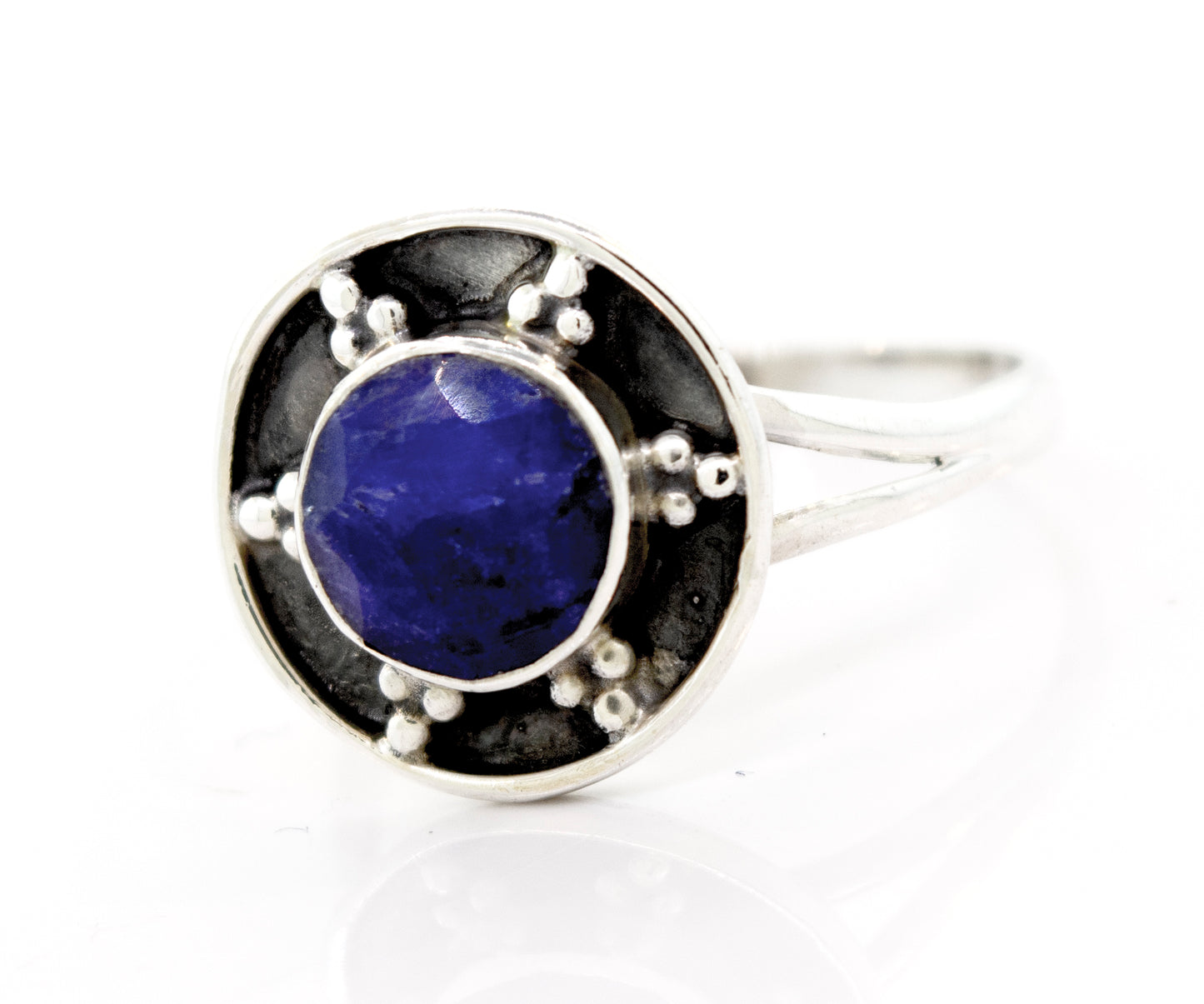 
                  
                    A Sapphire Ring With Unique Oxidized Silver Design featuring a lapis stone in the center, made by Super Silver.
                  
                