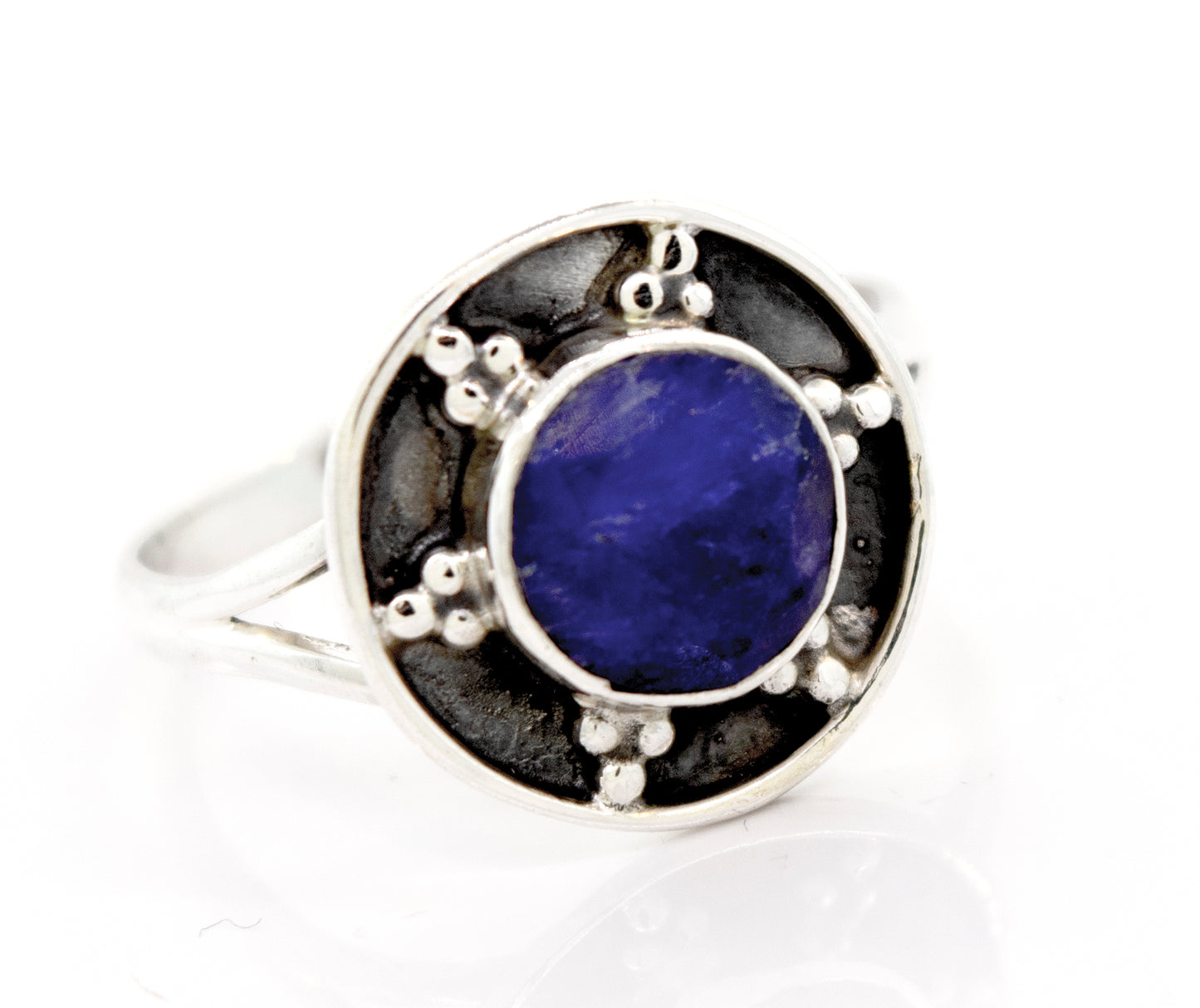 A Sapphire Ring With Unique Oxidized Silver Design by Super Silver, with a lapis stone in the center.