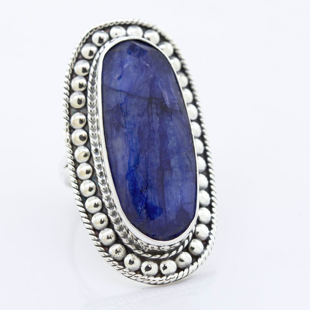 
                  
                    An Elegant Raw Blue Sapphire Ring with a sturdy blue sapphire stone by Super Silver.
                  
                
