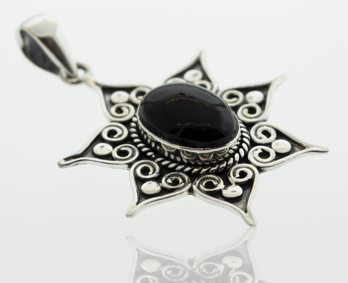 A sleek silver Super Silver Onyx Pendant with a black onyx stone, adorned with a spiral and rope border for an elegant touch.