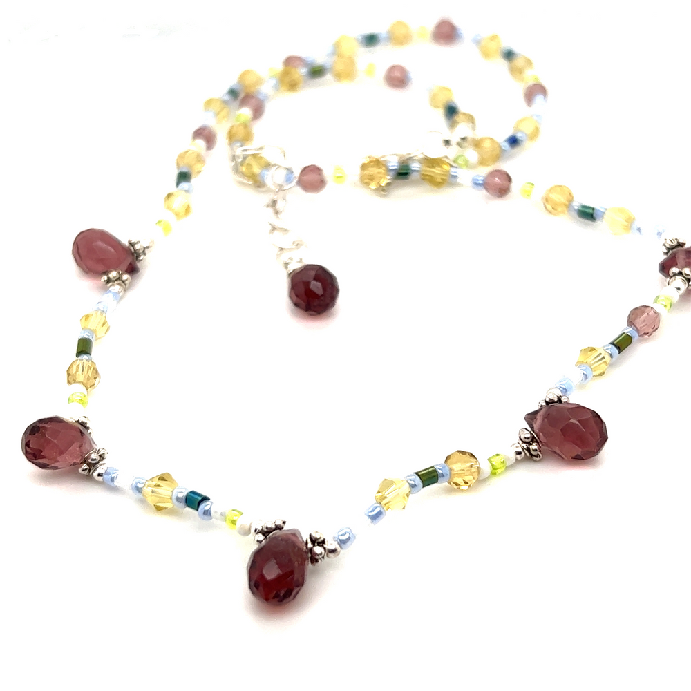 A Beaded Multicolor Necklace featuring red, yellow, and green glass beads by Super Silver.