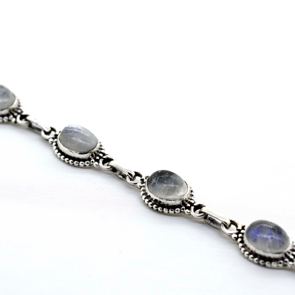 
                  
                    A Super Silver oval gemstone bracelet with moonstone stones, creating a beautiful Oval Gemstone Bracelet With Ball Border.
                  
                