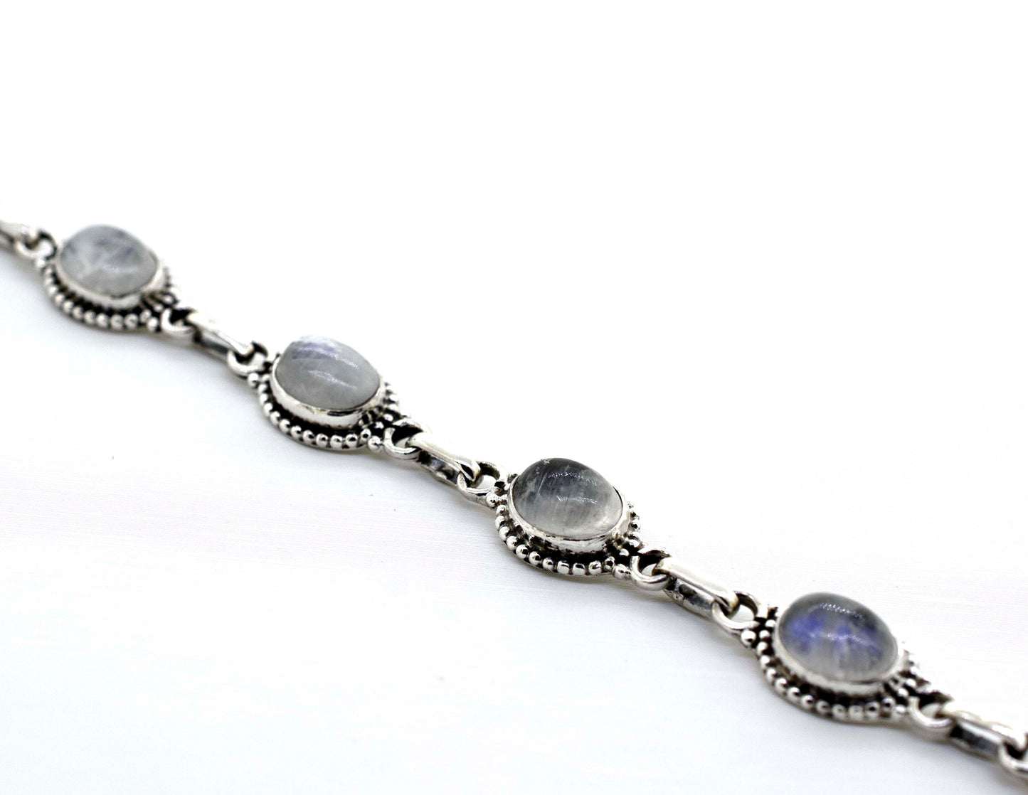
                  
                    A Super Silver oval gemstone bracelet with moonstone stones, creating a beautiful Oval Gemstone Bracelet With Ball Border.
                  
                