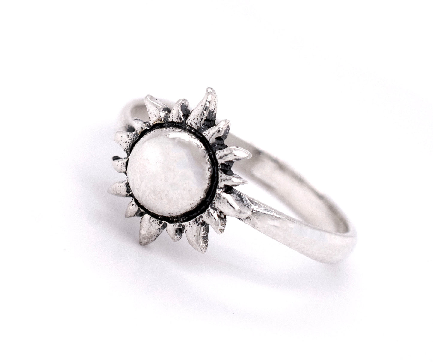 
                  
                    A minimalist style Super Silver Sun Ring with a white stone, made of sterling silver.
                  
                