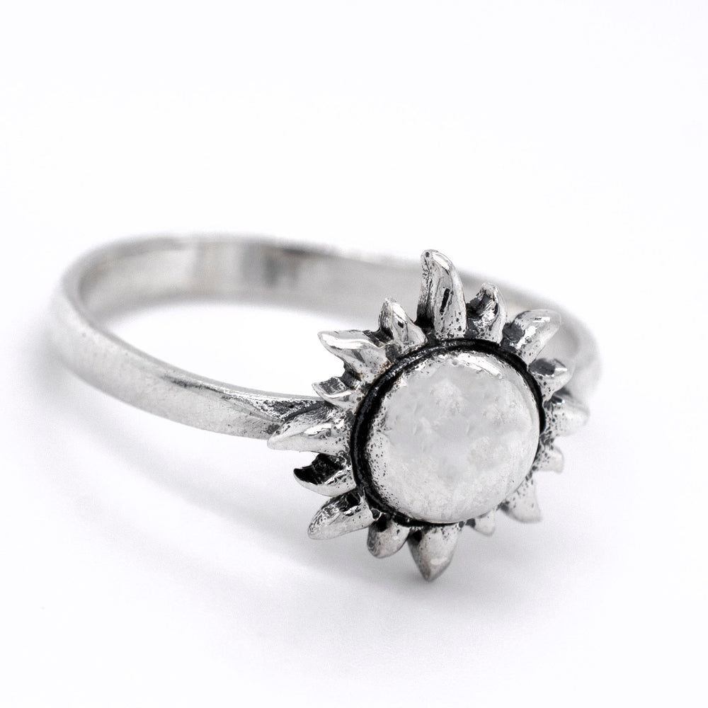 A minimalist style Super Silver  Silver Sun Ring with a white stone in the center.