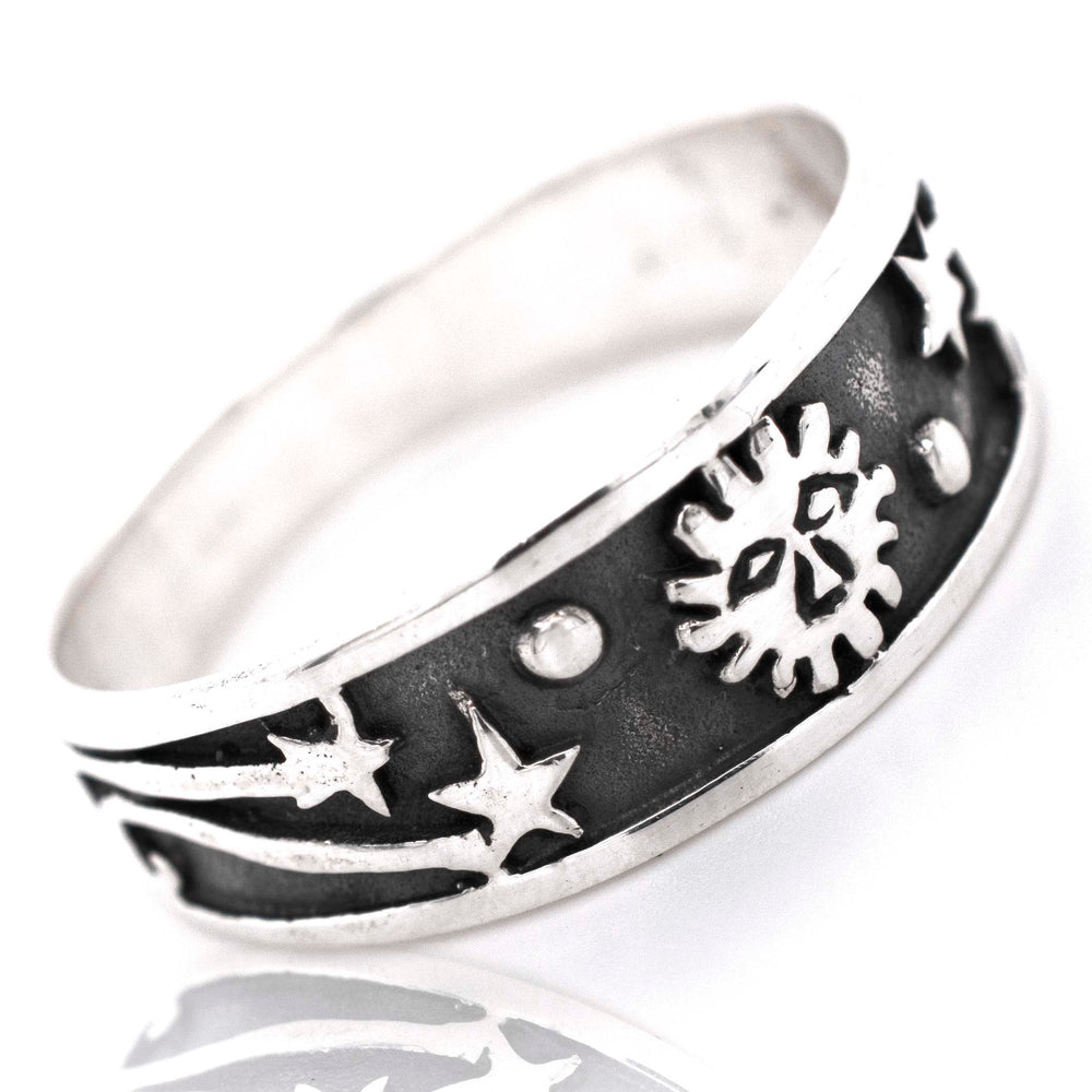 
                  
                    A boho-inspired Galaxy Ring With Shooting Stars adorned with celestial motifs of stars and suns.
                  
                