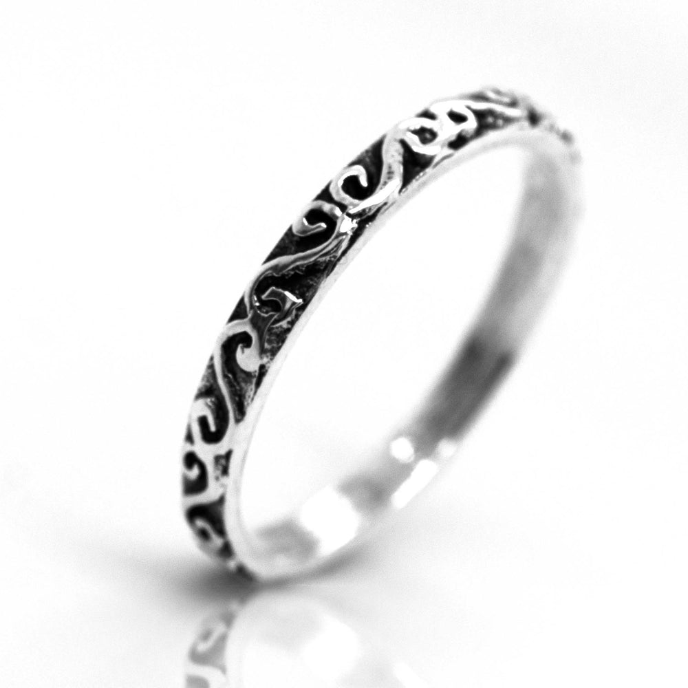 A Super Silver Simple Band With Swirl Design.
