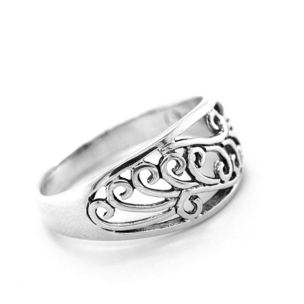 An artful Sweeping Domed Filigree Ring by Super Silver with an intricate design.