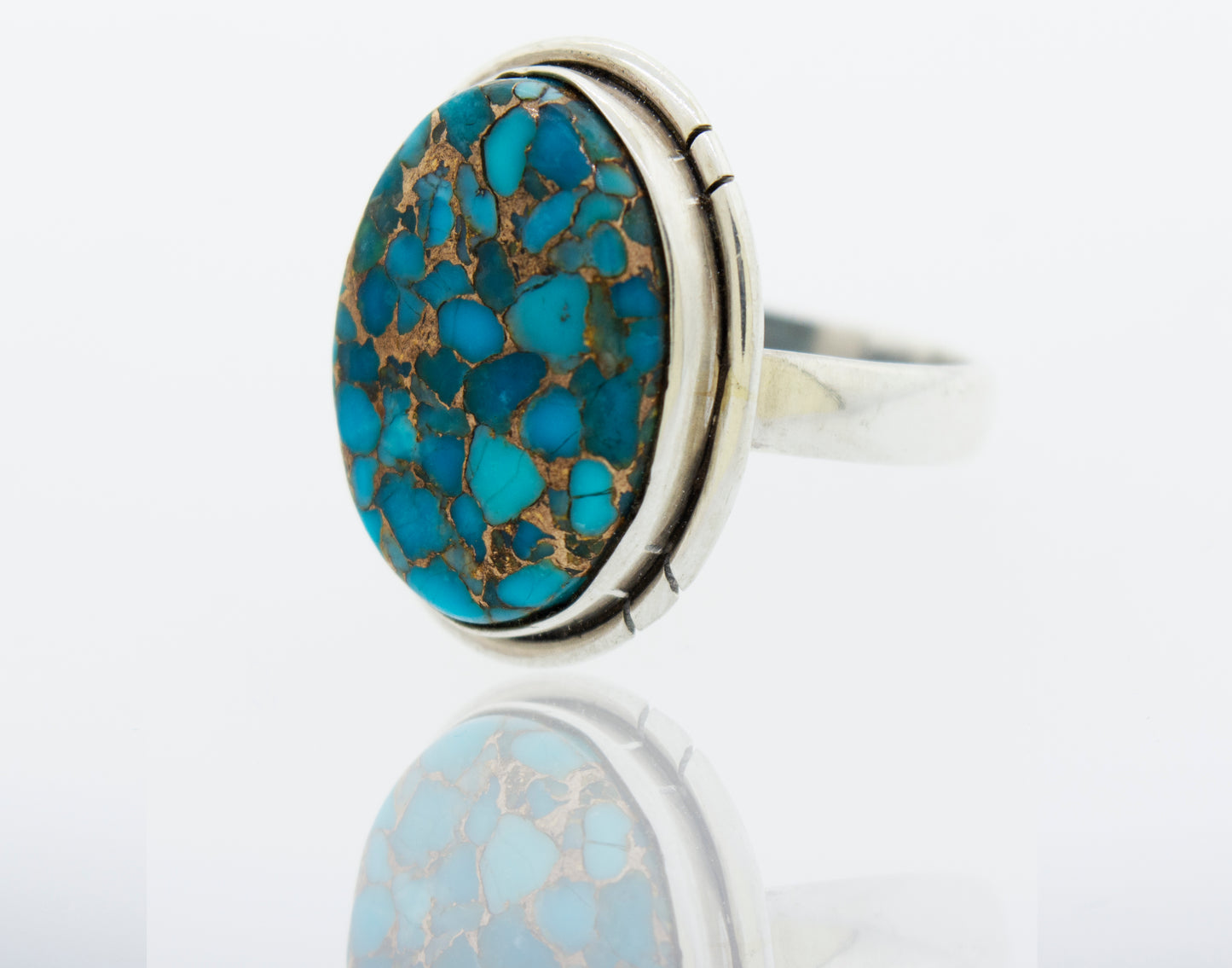 Description: An oval Natural Blue Copper Turquoise stone ring in sterling silver by Super Silver.