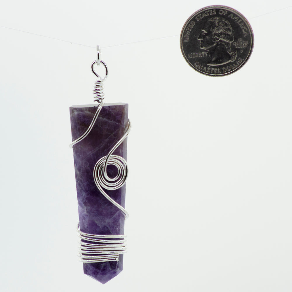 
                  
                    A Stone Slab pendant with wire wrapping hanging from a Super Silver chain.
                  
                