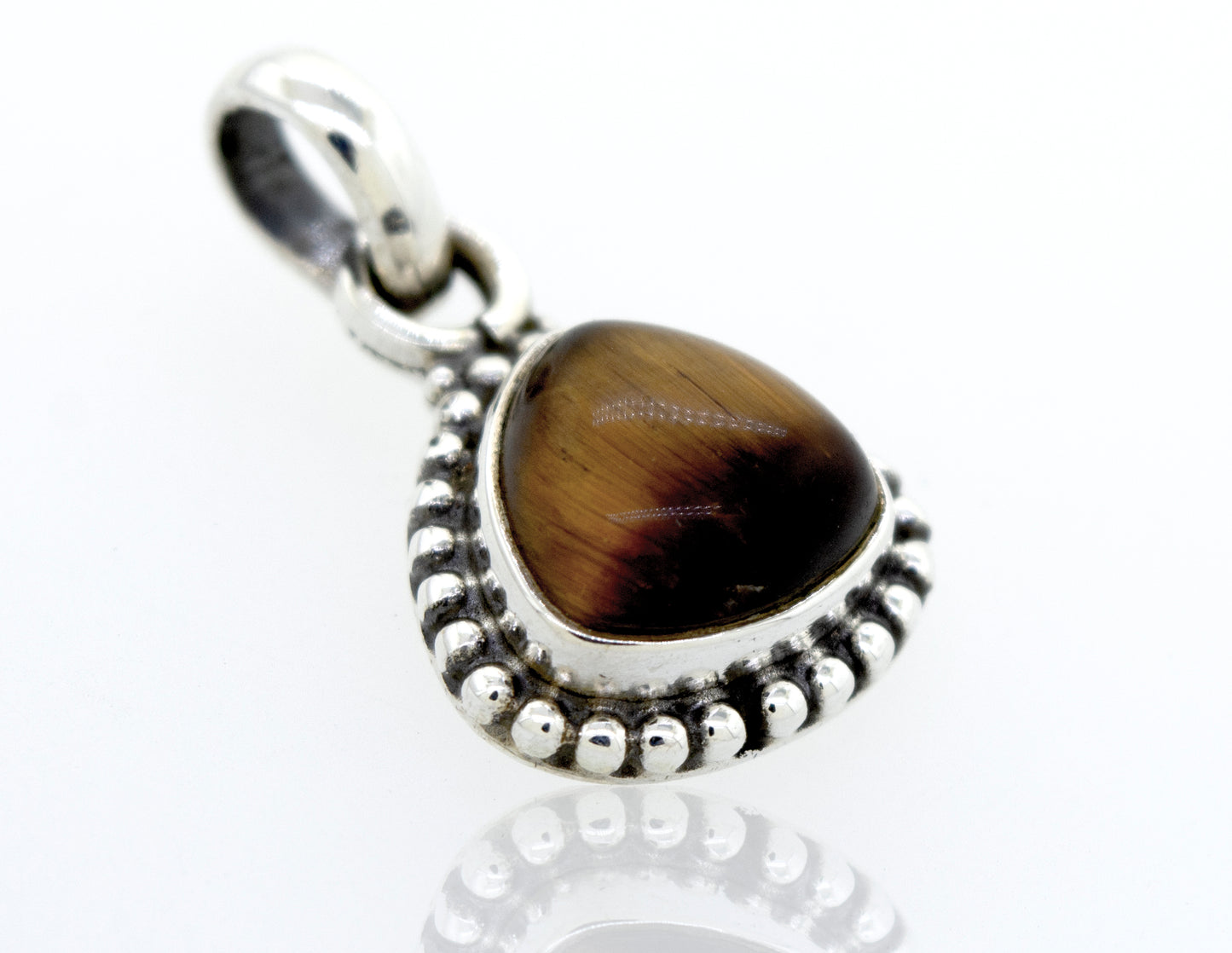 
                  
                    A Super Silver Beautiful Triangular Shape Tiger's Eye Pendant With Beads Design featuring a tiger's eye stone.
                  
                