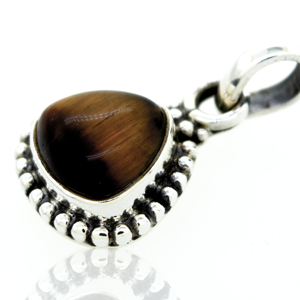
                  
                    A Beautiful Triangular Shape Tiger's Eye Pendant with Beads Design from Super Silver.
                  
                