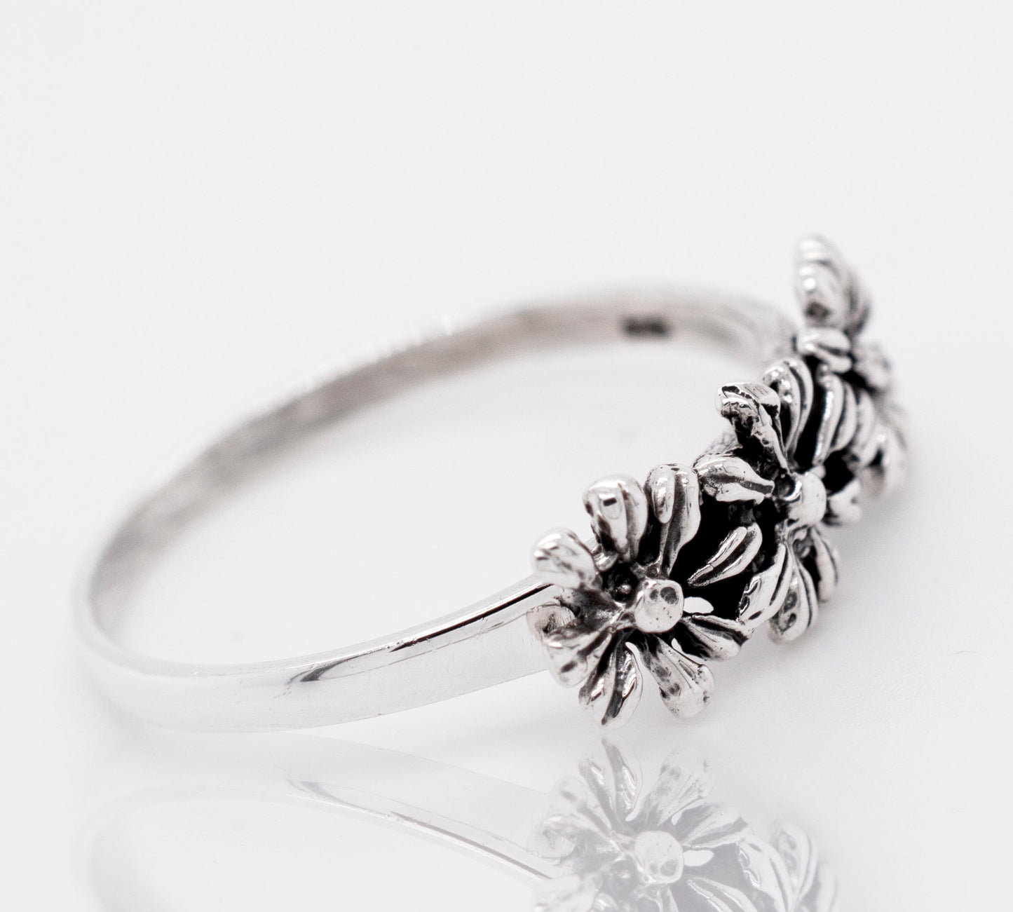 Dainty Three Flowers Design Ring with intricate flower design.