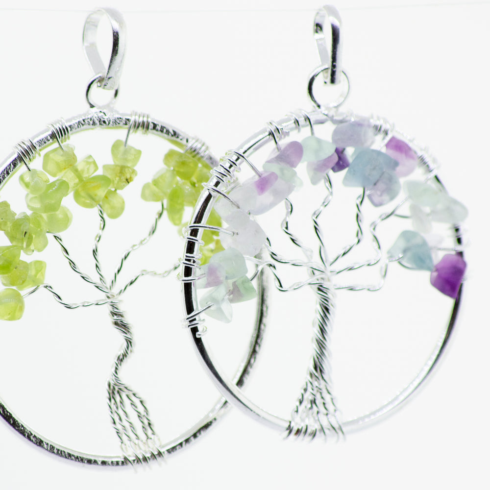
                  
                    This Super Silver Wire Wrapped Tree of Life pendant features green and purple stones, complemented by a sterling silver chain that adds elegance to the overall design. The addition of amethyst stones further enhances its natural beauty.
                  
                