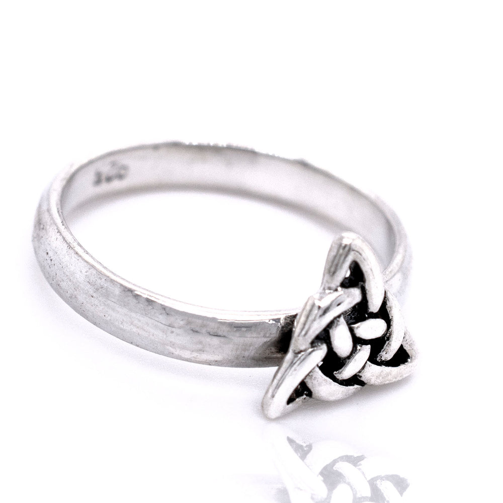 
                  
                    A Dainty Celtic Triangle Ring with a Celtic knot on it.
                  
                