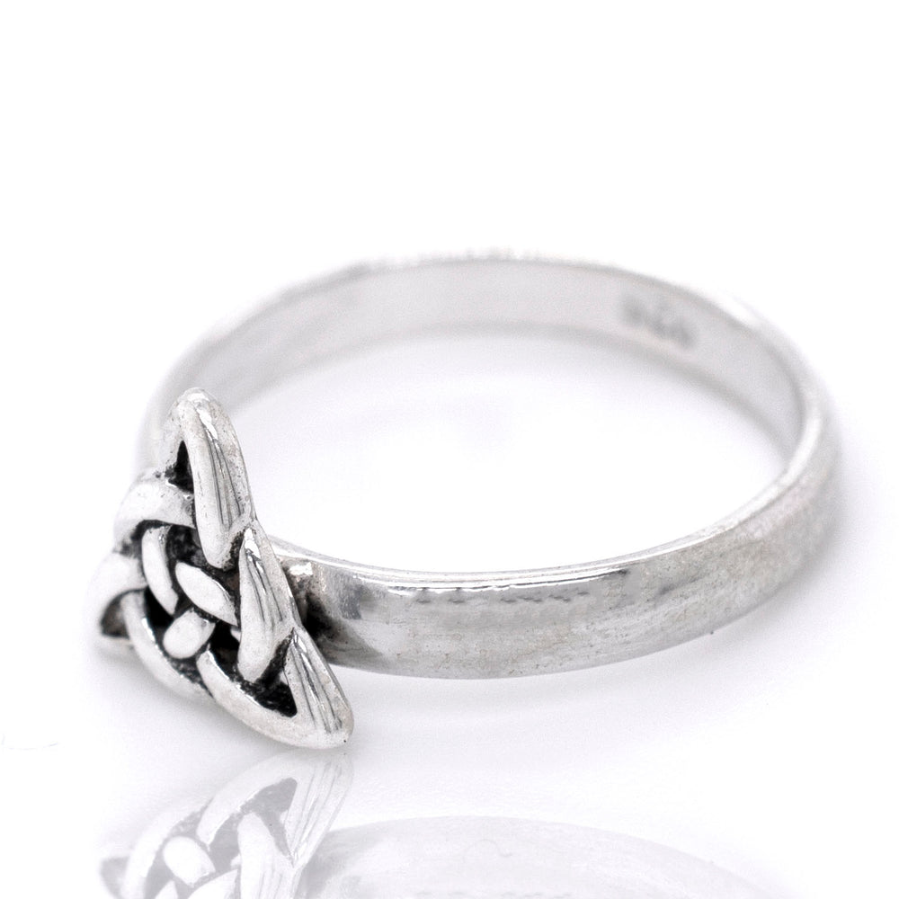 A sterling silver ring with a Dainty Celtic Triangle Ring design.