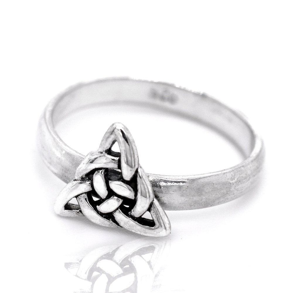 
                  
                    A cultural-inspired Dainty Celtic Triangle Ring with a celtic knot design.
                  
                