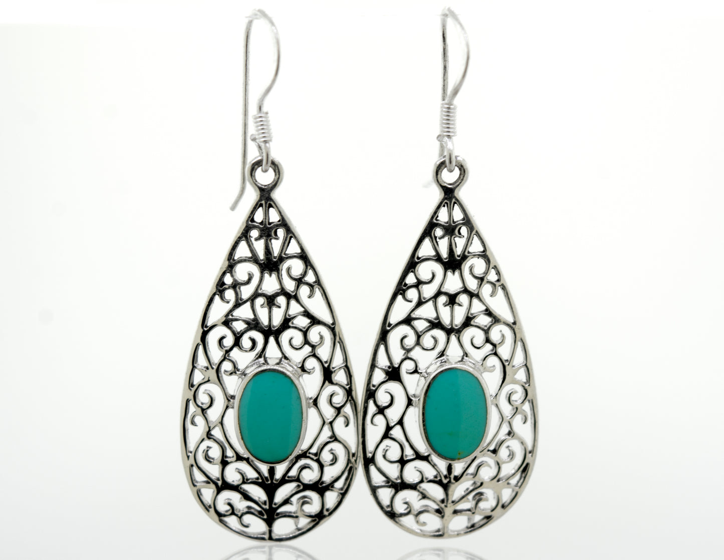 
                  
                    A pair of Elegant Teardrop Shape Turquoise Earrings with a filigree design, made from sterling silver, by Super Silver.
                  
                