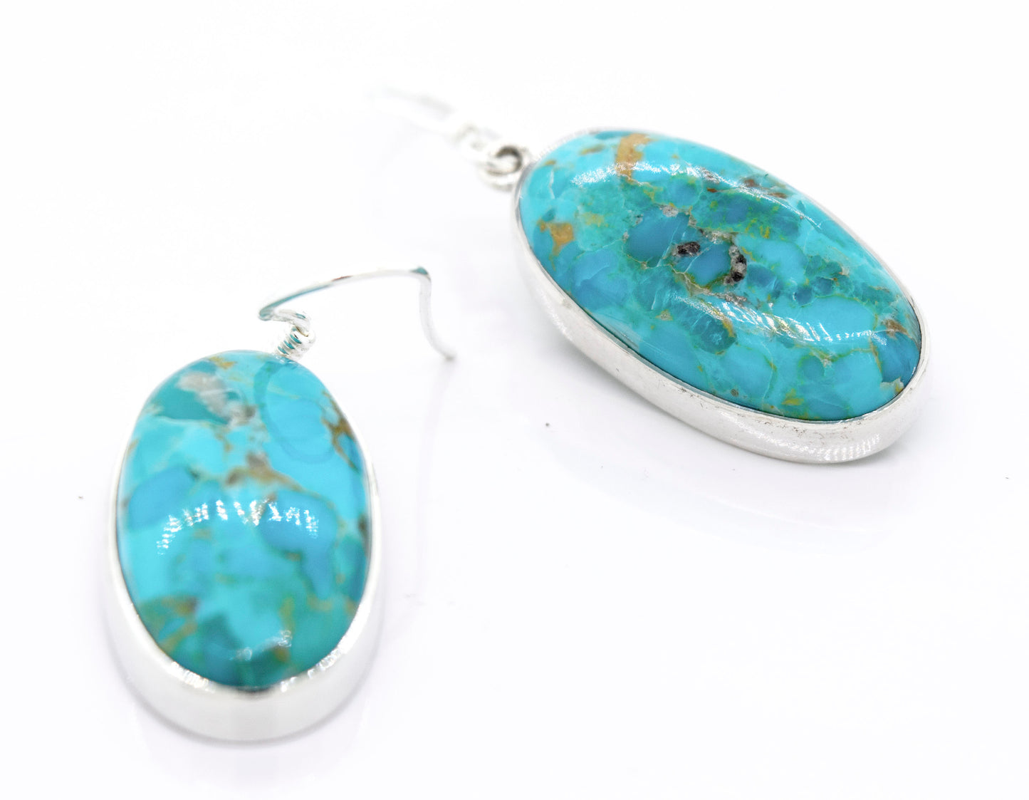
                  
                    A pair of Super Silver Beautiful Oval Shape Composite Turquoise Earrings on a white surface.
                  
                