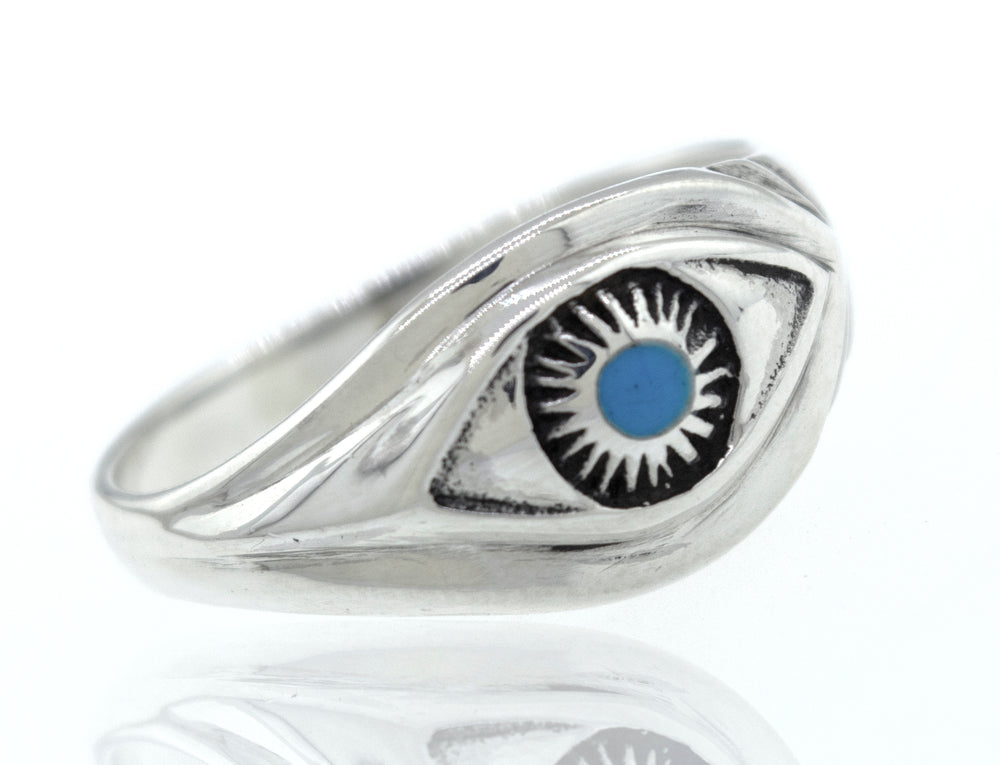 A Super Silver turquoise eye ring with an evil eye on it.
