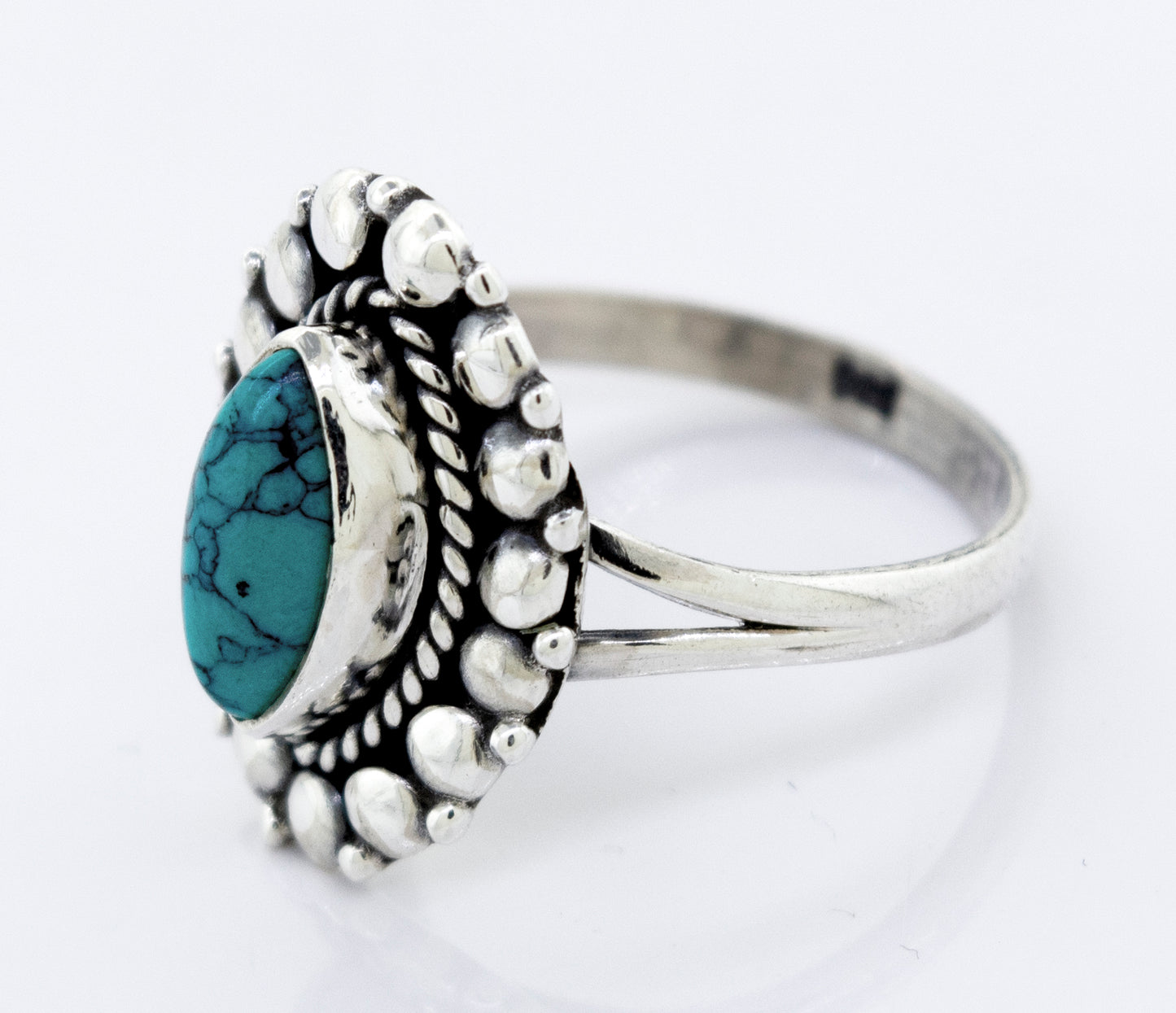A Super Silver ring with a Marquise Shaped Vibrant Turquoise Stone.