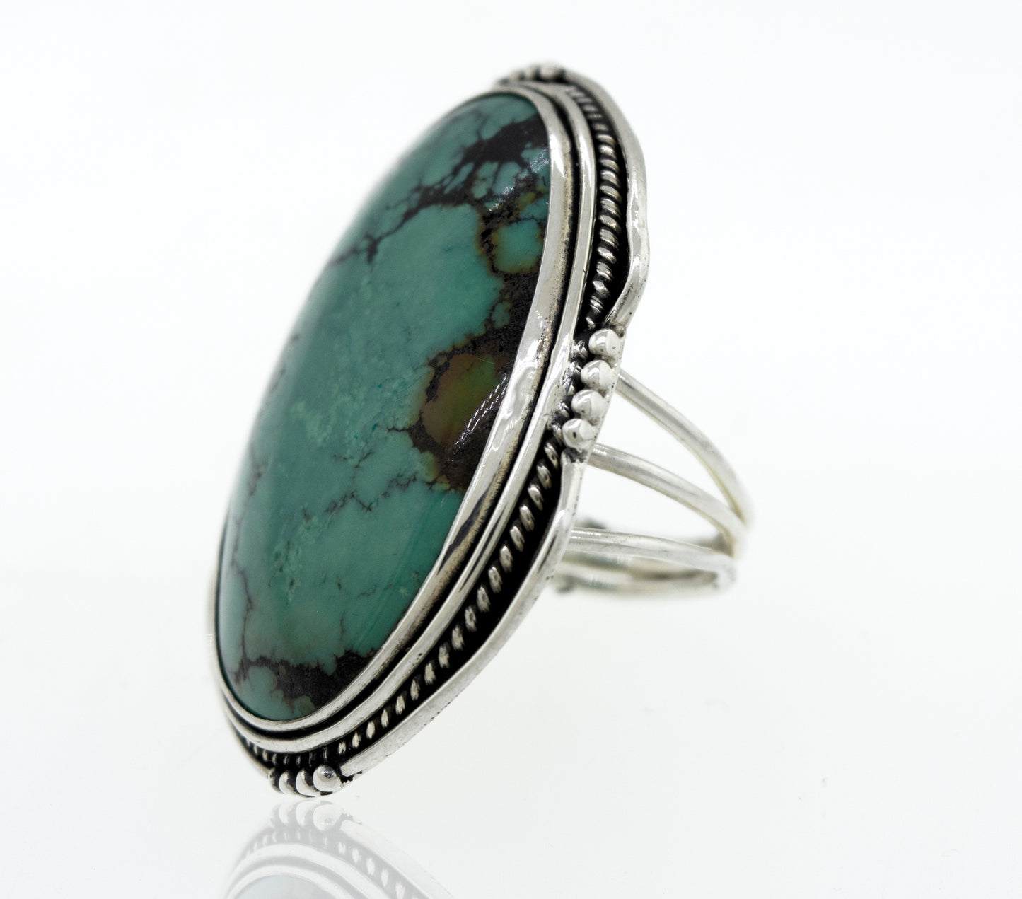 
                  
                    A Super Silver Oval Natural Turquoise Ring With Rope And Ball Border.
                  
                