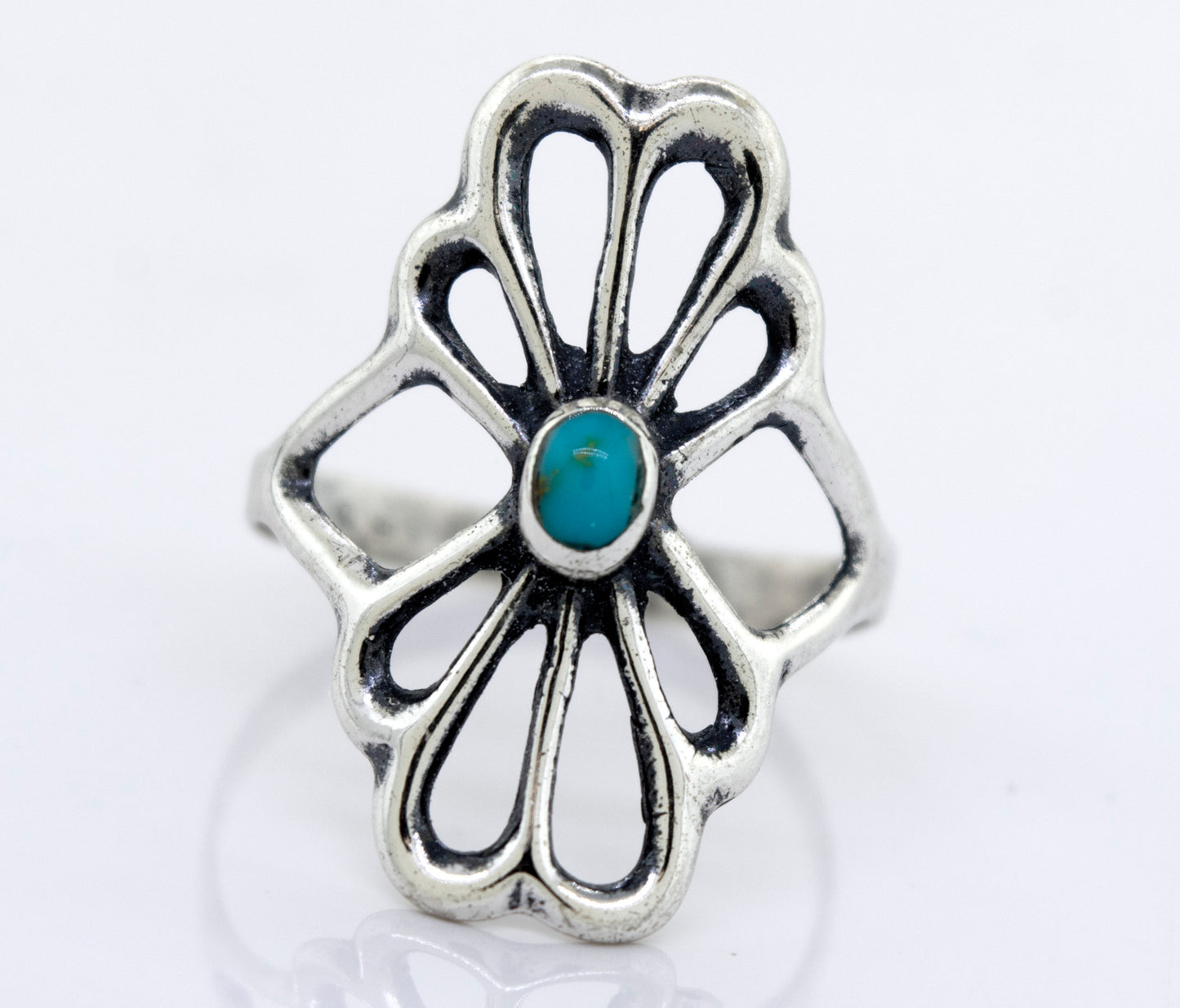 
                  
                    A Super Silver American Made Flower Ring with an oval turquoise stone.
                  
                
