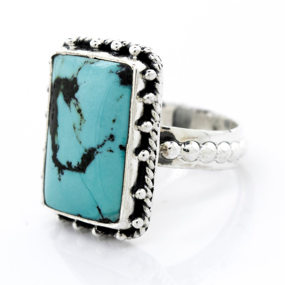 A Rectangular Shape Natural Turquoise Ring With Ball Border from Super Silver.