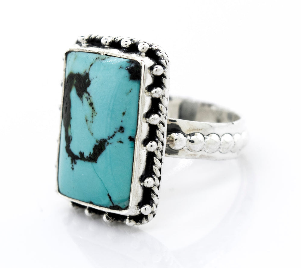 A Rectangular Shape Natural Turquoise Ring With Ball Border from Super Silver.