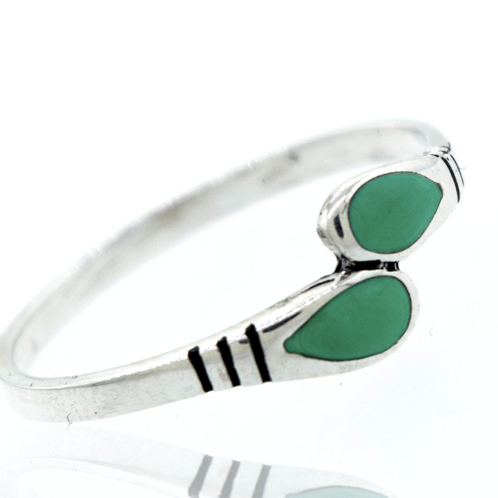 An elegant Super Silver ring with two Green Turquoise Teardrop Shape stones.