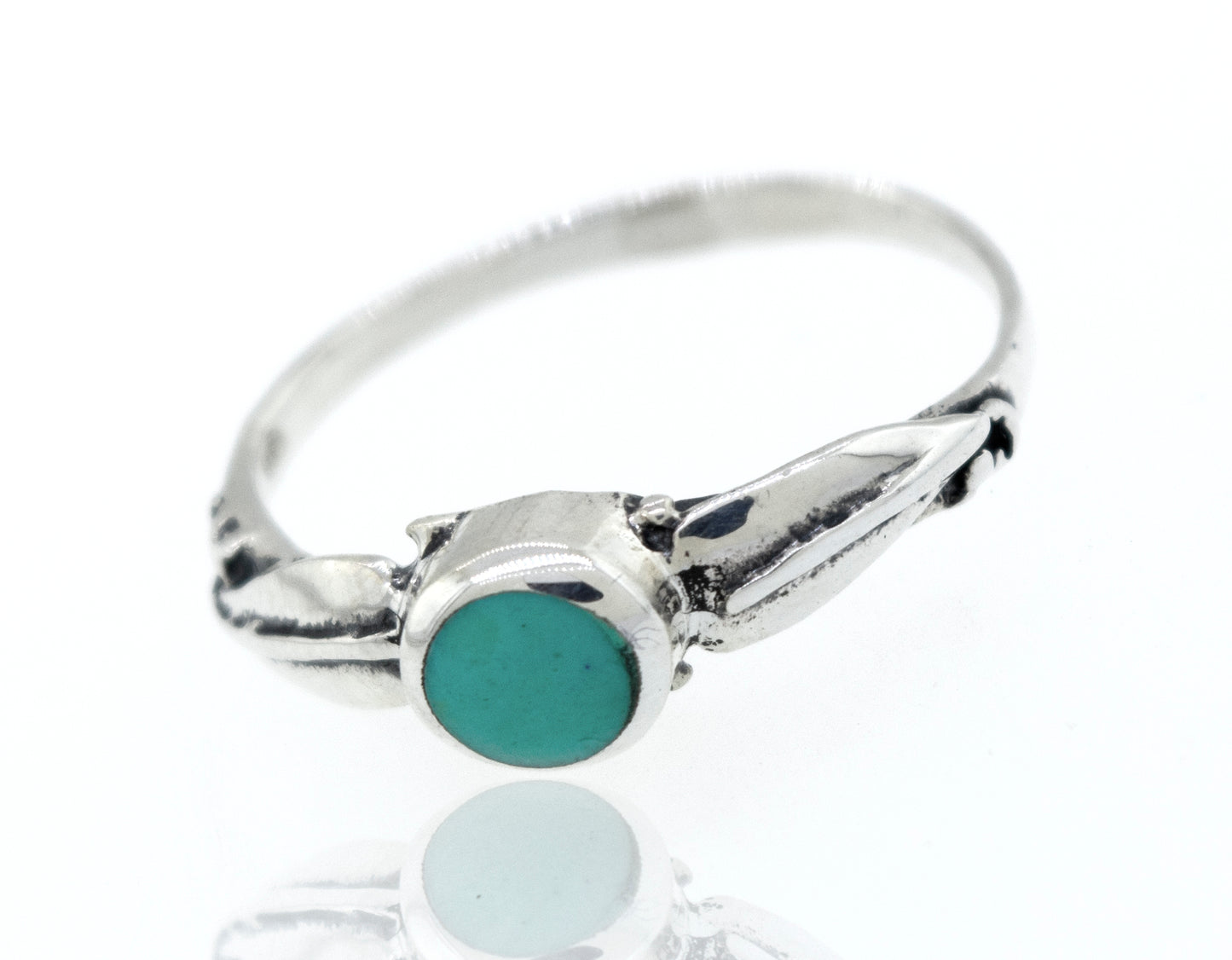 
                  
                    Round Turquoise Ring With Leaf Design On Either Side
                  
                