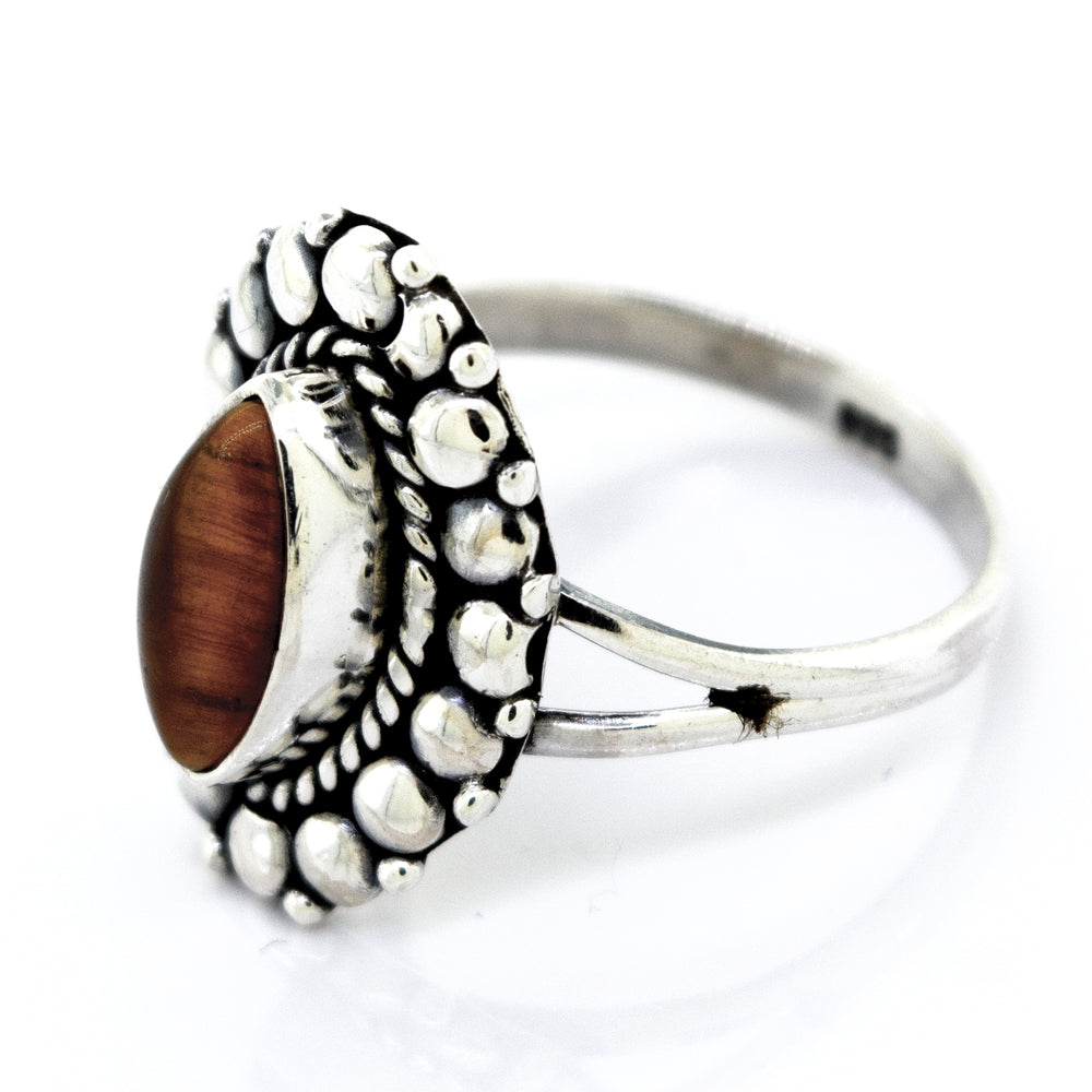 
                  
                    The description of the Marquise Shaped Vibrant Tiger's Eye Ring from Super Silver captures its beautiful and vibrant nature.
                  
                