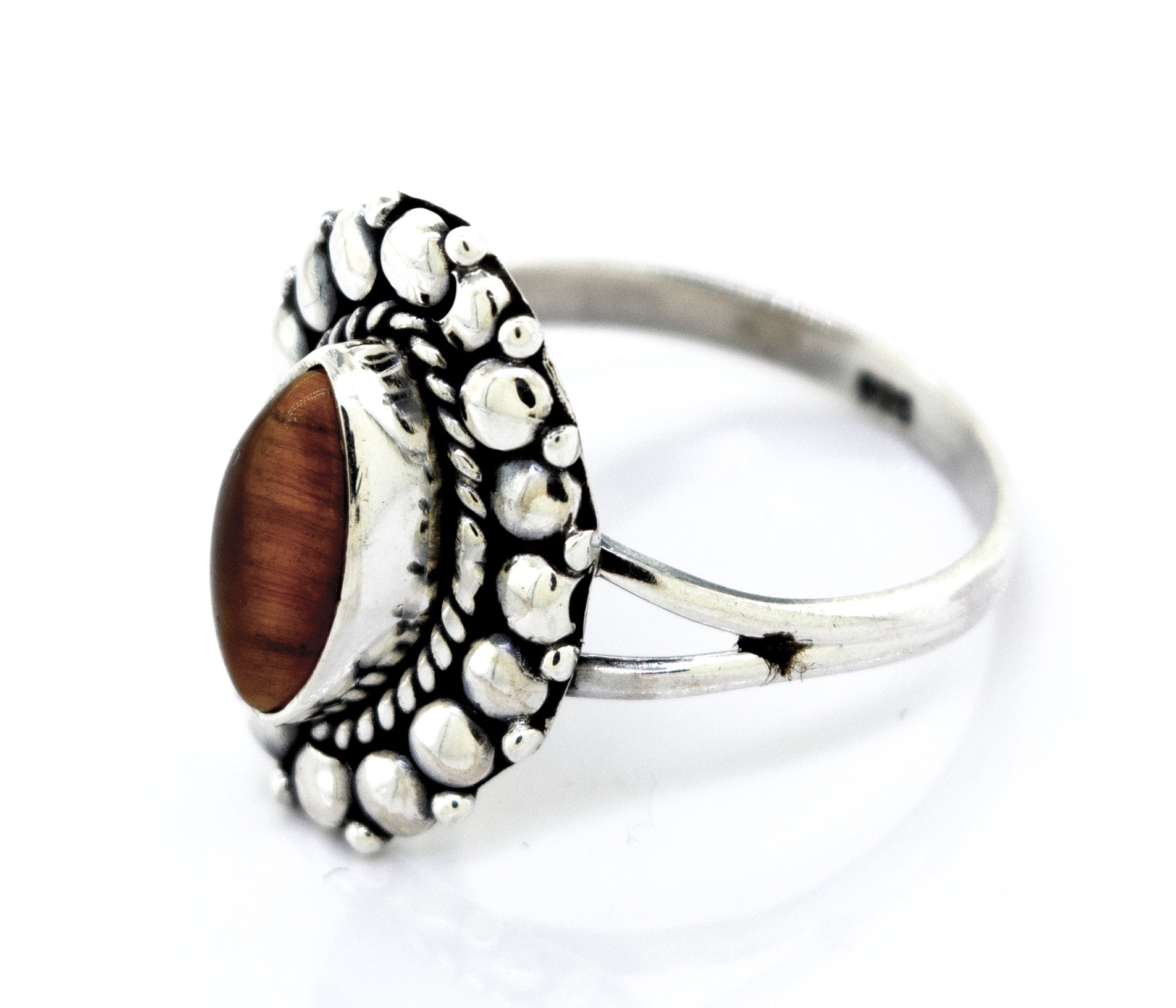 The description of the Marquise Shaped Vibrant Tiger's Eye Ring from Super Silver captures its beautiful and vibrant nature.