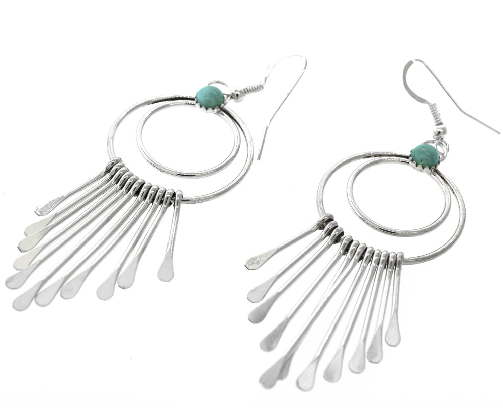Handmade Super Silver Native American earrings with Alluring Turquoise Chandelier stones.
