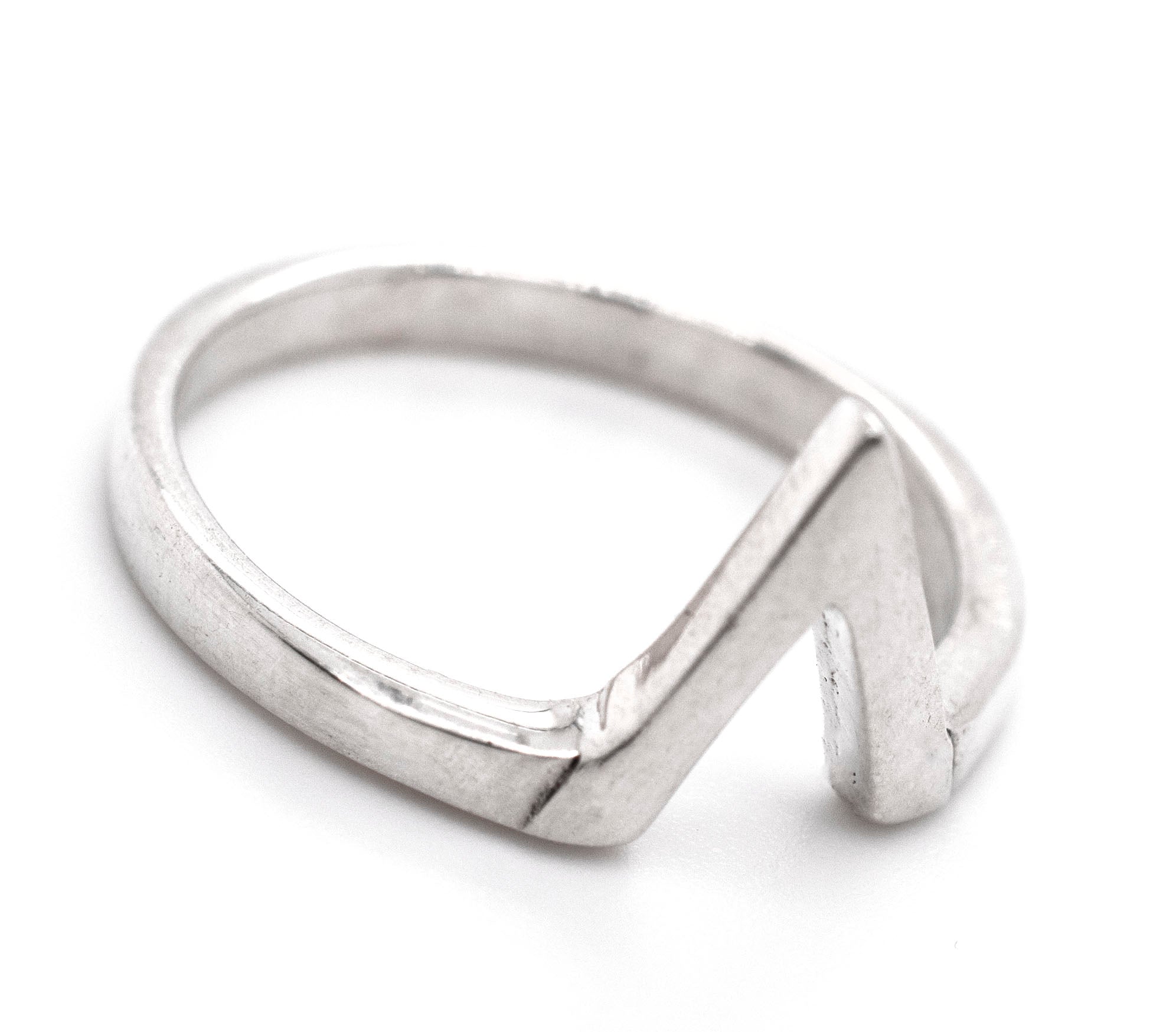 A minimalist silver ring with a Simple "V" Shape design.