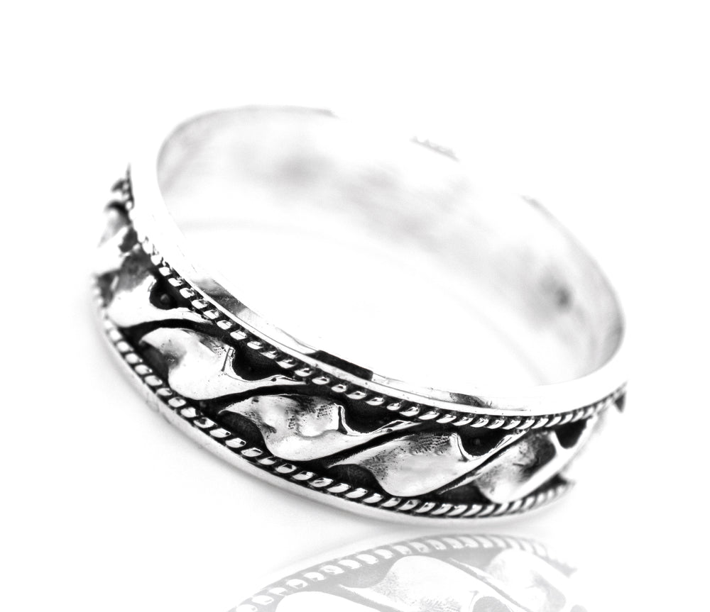 A silver mens ring with a braided Celtic design, the Captivating Wavy Rope Band.